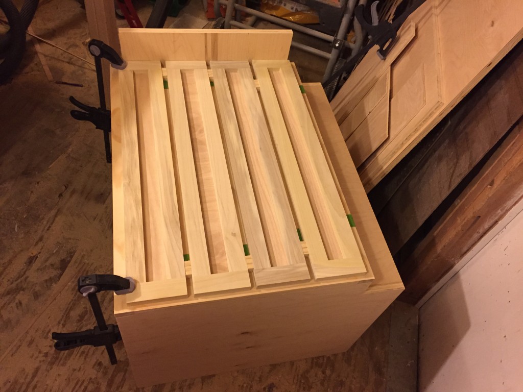 In the process of attaching drawer fronts.