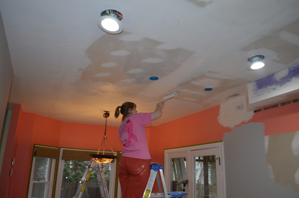 Painting the ceiling.