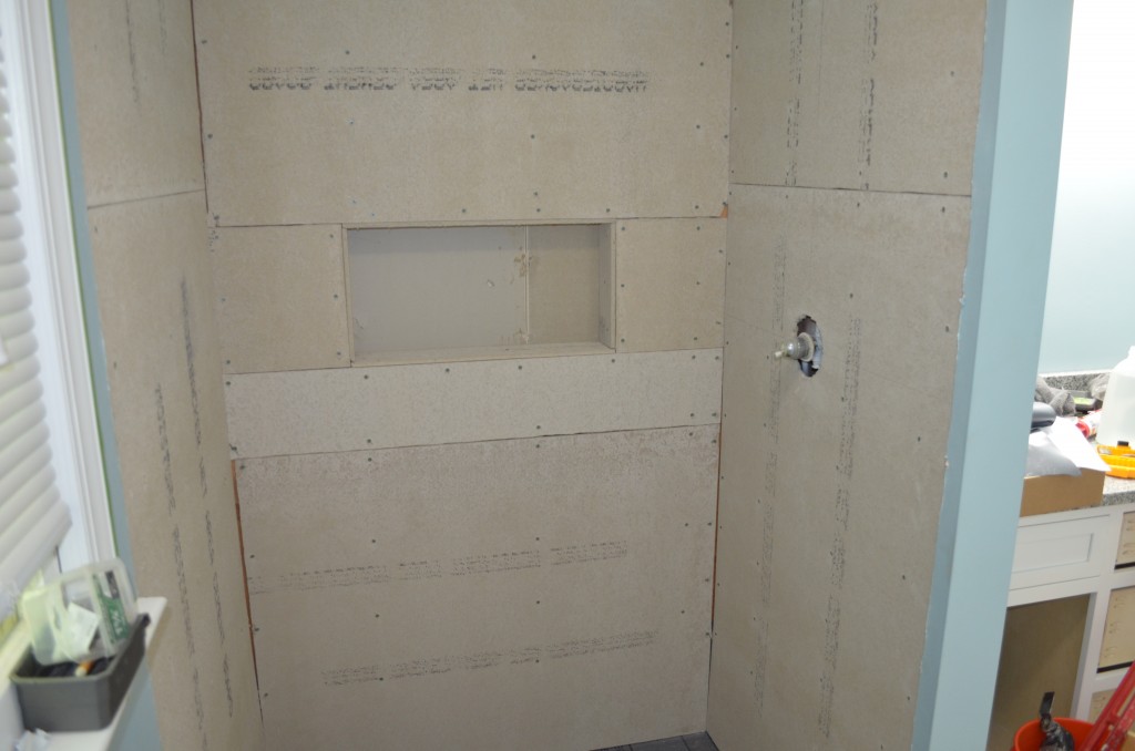 Shower enclosed by cement board (final piece in nook missing in this picture).
